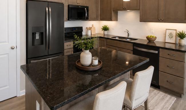 a kitchen with a black countertop